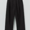 Pantalon en coton et laine à chevrons avec plis sur le devant