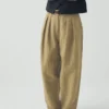 Pantalon en coton et lin à rayures et plis sur le devant