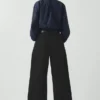 Pantalon en denim à plis sur le devant